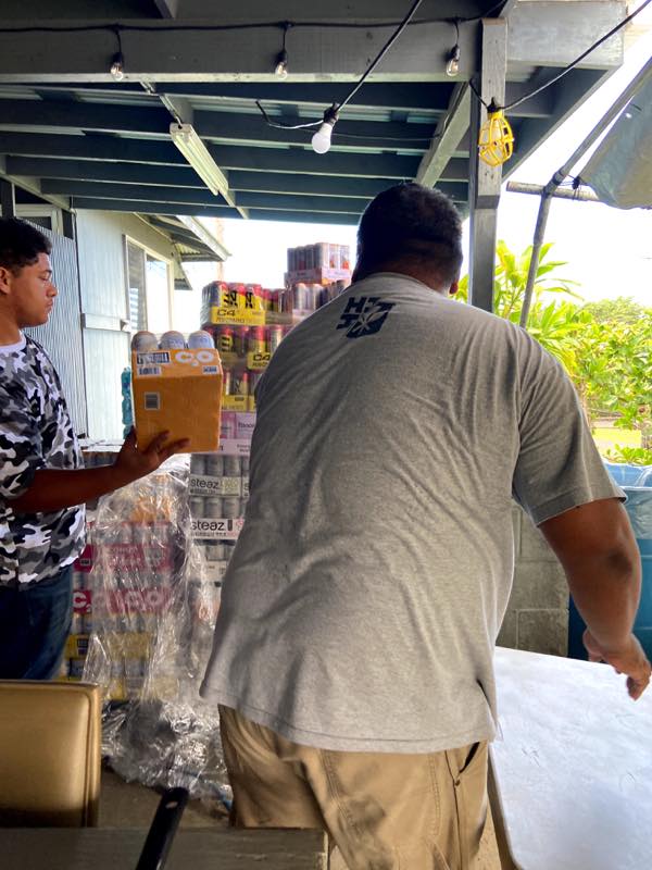 Volunteers organize donated beverages